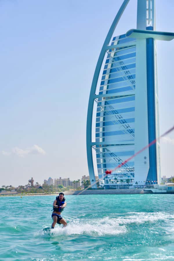 WakeBoard : Ski on the Dubai Sea Water on Wakeboard - Riding a wakeboard with Dubai in view